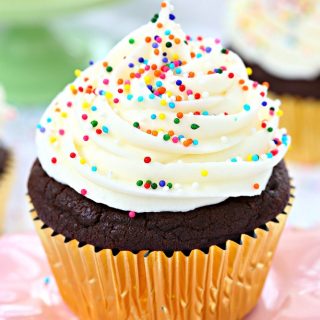 So soft, fluffy, and full of chocolate flavor in every bite, these sugar cookie chocolate cupcakes are piled high with cream cheese frosting and finished with colorful sprinkles!