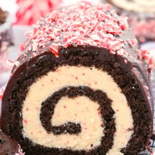 A delicious chocolate cake filled with an irresistible peppermint white chocolate filling, this chocolate peppermint bark roll cake is perfect for the Christmas holiday! Don't be intimidated by its festive swirl, follow my tips for a successful roll cake every time!