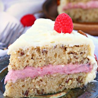 Incredibly moist, tender and delicious this white chocolate pecan cake has a subtle white chocolate flavor and crunchy pecans in every bite. The raspberry white chocolate frosting is rich, creamy and delicious. One bite and you can't stop!